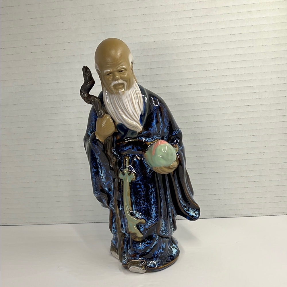Intricate‎ Blue and Brown Sculpture with Traditional Patterns